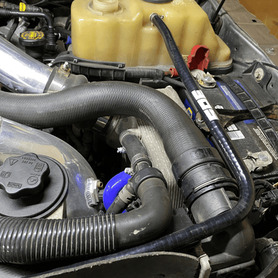 SPE Motorsport 6.7 Powerstroke Coolant Hose Reroute Kit at coolant tank